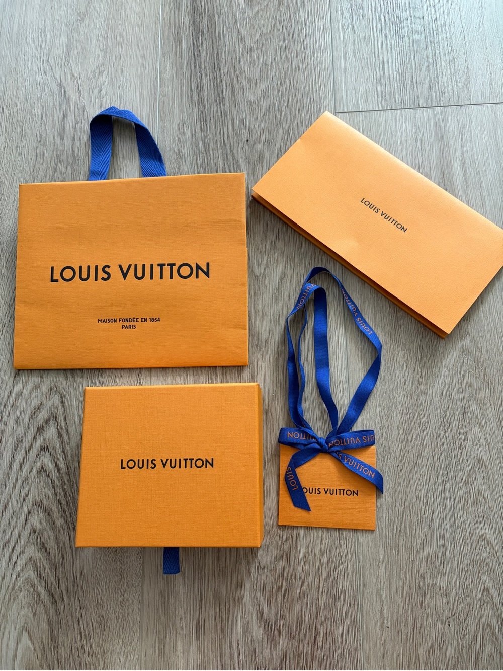 Louis Vuitton Orange Gift Set with Blue Ribbon Accents